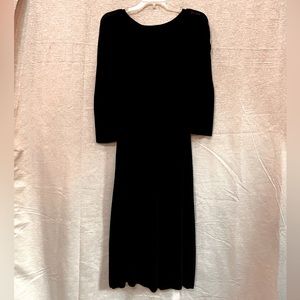 Black, light knit, dress. Beyond knee length. Fitted waste.